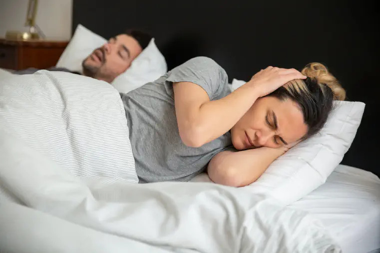 How to Fall Asleep with Someone Snoring